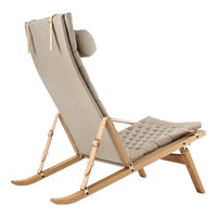 Beige quilted fabric chair with natural wood accents and a modern, minimalist design.