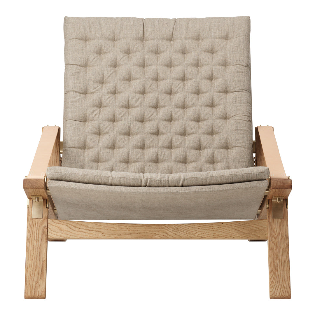 Beige tufted fabric lounge chair with a wood frame, featuring a minimalist design and soft texture. Perfect for modern decor.