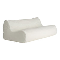 White, smooth surface sofa with a minimalist design, featuring a sleek, modern silhouette and soft contours.