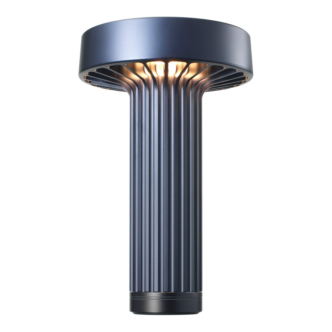 Modern blue table lamp with ribbed design and metallic finish, offering sleek and stylish illumination.
