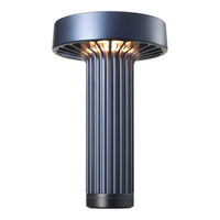 Modern blue table lamp with ribbed design and metallic finish, offering sleek and stylish illumination.