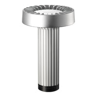 Silver table lamp with a sleek ribbed design and a round, flat top featuring a light grey surface.