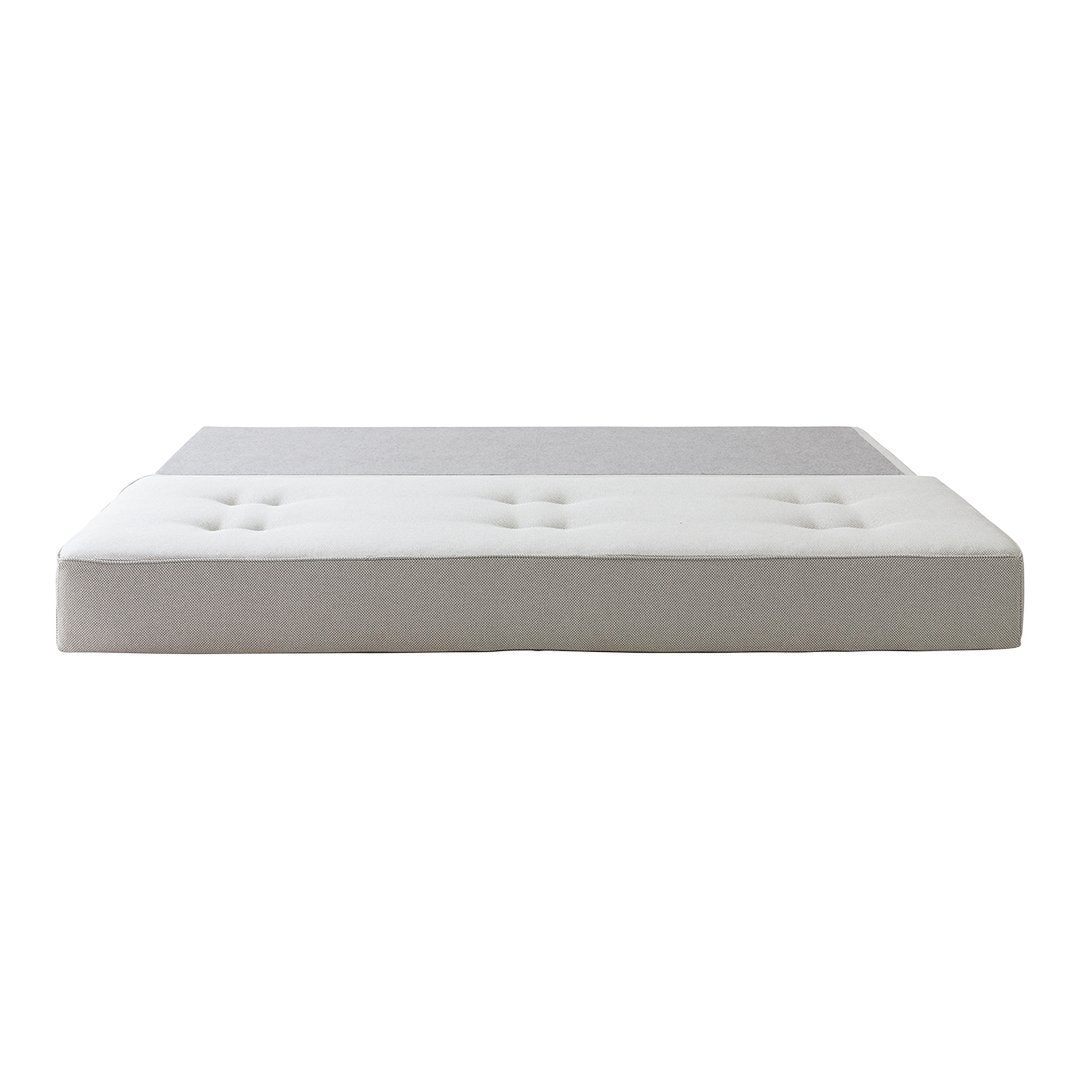 Modern two-tone mattress in gray and white, featuring a smooth design with button accents for a stylish touch.