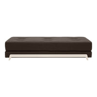 Brown upholstered sofa with tufted design and sleek white metal base, ideal for modern interiors.