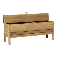 Light natural wood storage bench with a smooth finish and slatted design, ideal for modern home decor.