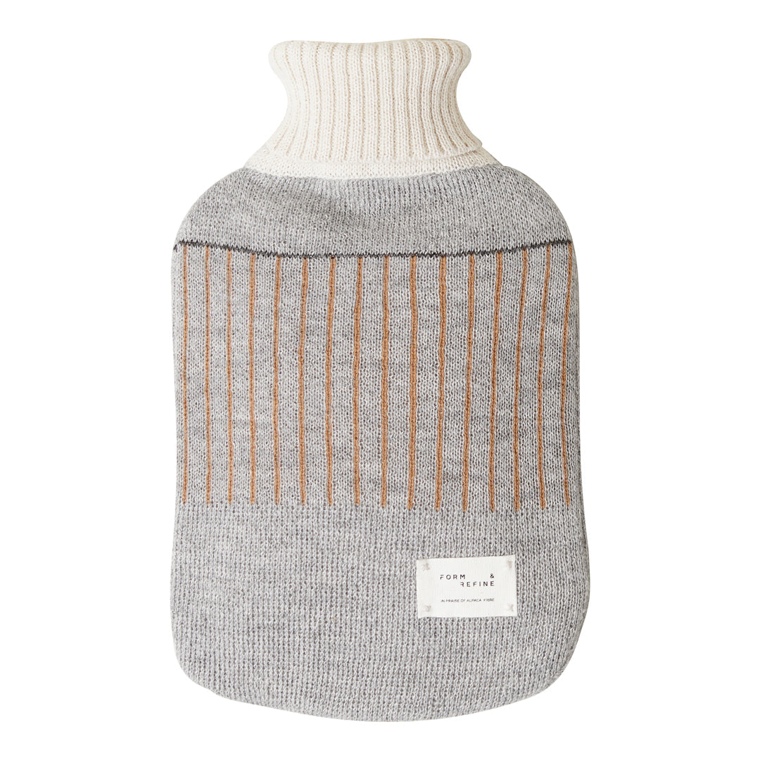 Grey and cream knitted hot water bottle with vertical brown stripes, featuring a ribbed neck. Perfect for cozy warmth.