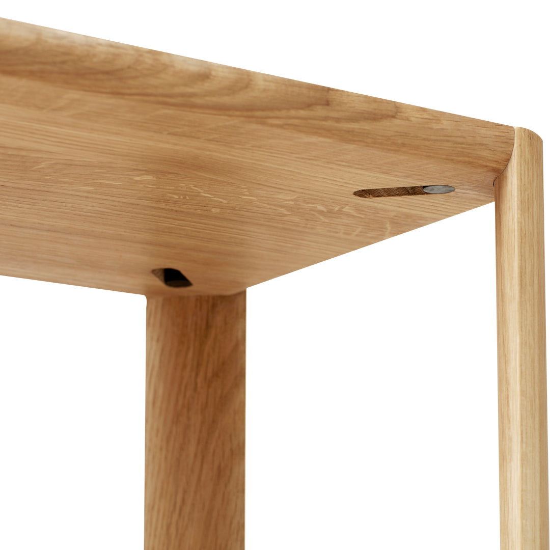 Natural oak wood table with a smooth finish and subtle grain patterns, showcasing warm beige tones and minimalist design.