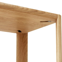 Natural oak wood table with a smooth finish and subtle grain patterns, showcasing warm beige tones and minimalist design.