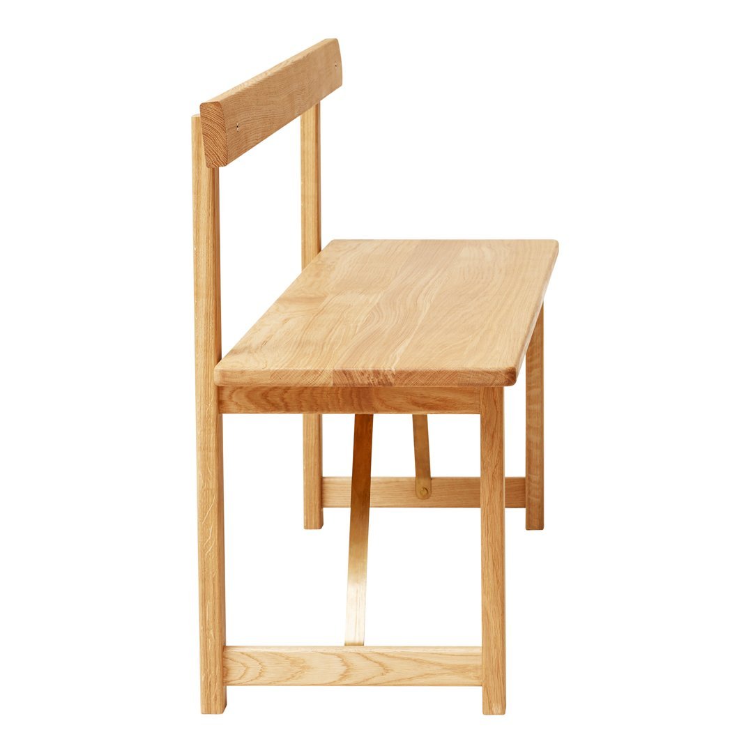 Light oak wooden bench with a simple, modern design and natural grain pattern.