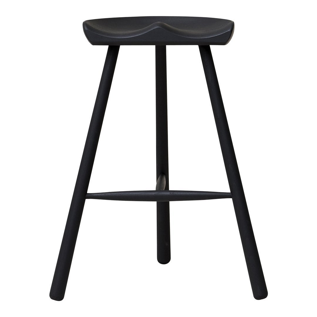 Black wooden bar stool with sleek, minimalistic design and smooth, curved seat pattern.