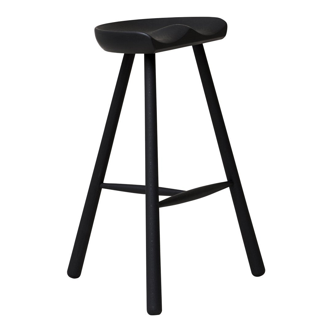 Sleek black stool with a minimalist design and smooth, curved seat. Perfect for modern interiors.