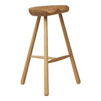 Natural wood bar stool with a light finish and smooth, curved seat design, featuring simple, clean lines.