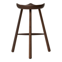 Solid wood bar stool in rich dark brown with a smooth, minimalist design and tapered legs. Ideal for modern interiors.
