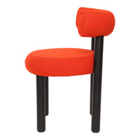 Red upholstered chair with circular seat and black wooden legs, featuring a unique rolled backrest design.