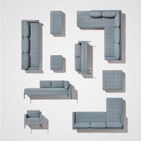 Gray upholstered modular sofa set with tufted patterns, various arrangements, and sleek metal legs.