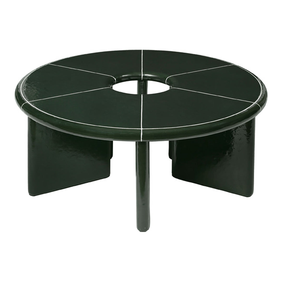 Green round coffee table with glossy finish and white line accents. Modern geometric pattern for stylish decor.