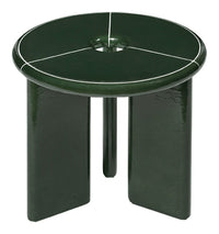 Green ceramic stool with glossy finish and white geometric lines on the circular top. Elegant modern design.
