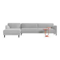 Stylish gray sectional sofa with modern lines, paired with a vibrant orange side table. Perfect for contemporary decor.