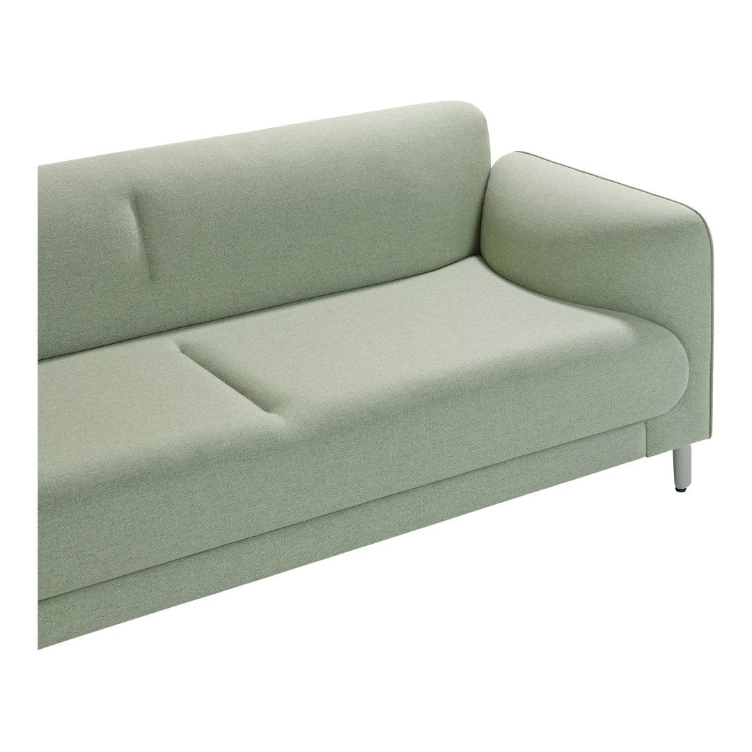 Light green sofa with a smooth fabric texture and minimalist design, featuring a single armrest and clean lines.