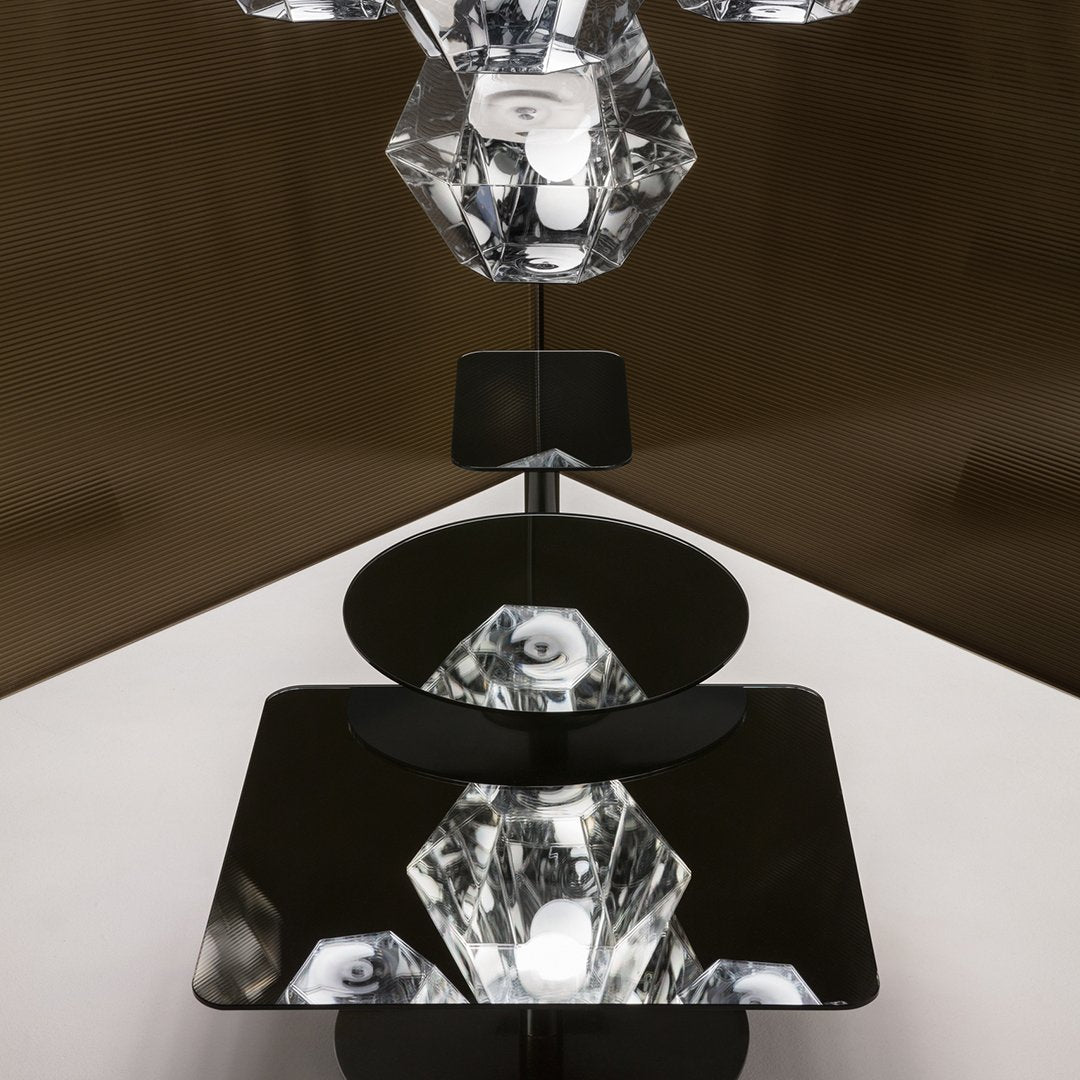 Geometric shapes in clear crystal and sleek black surfaces, creating a modern and elegant design.