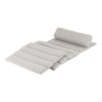 Light gray outdoor cushion with a textured striped pattern and rolled headrest for added comfort.
