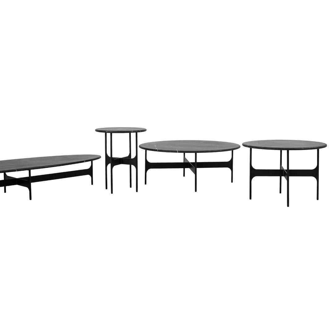Set of four modern coffee tables in sleek black with smooth surfaces and minimalist design for contemporary decor.