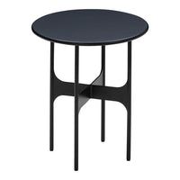 Round black side table with sleek legs and minimalistic design, perfect for modern decor.