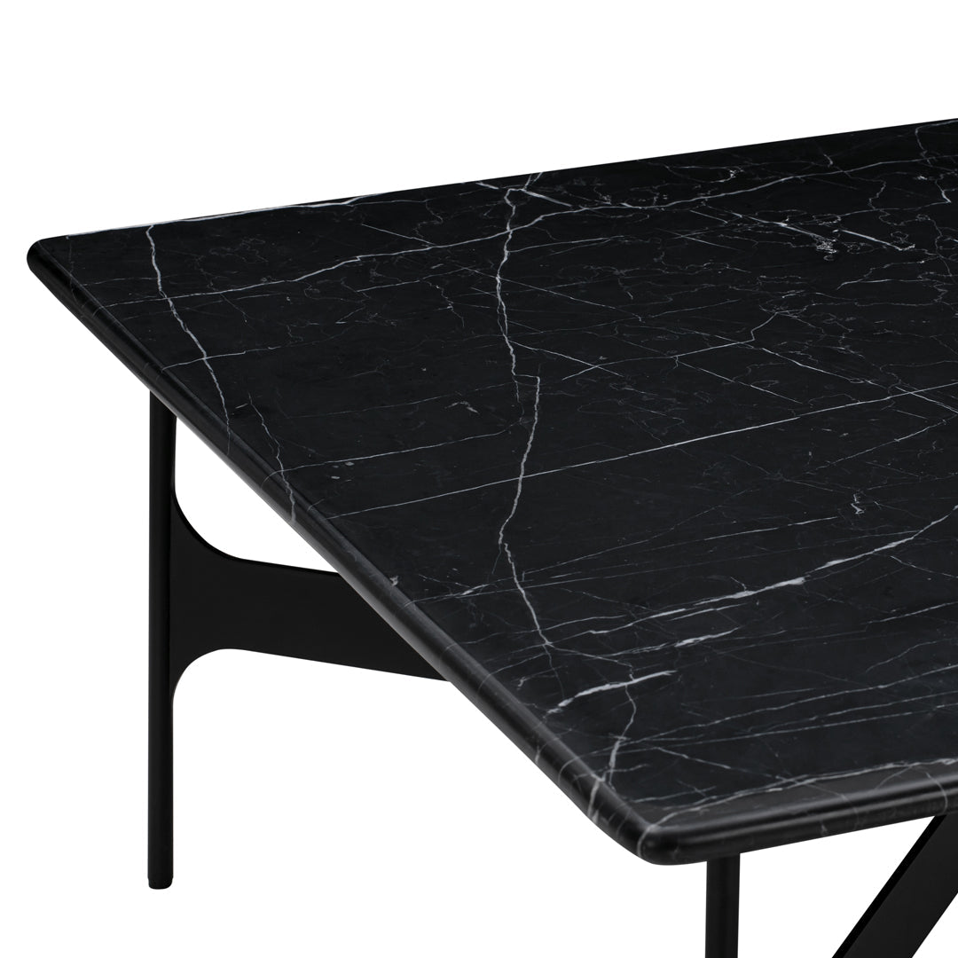 Black marble tabletop with white veining pattern, set on a sleek black metal base. Ideal for modern decor.