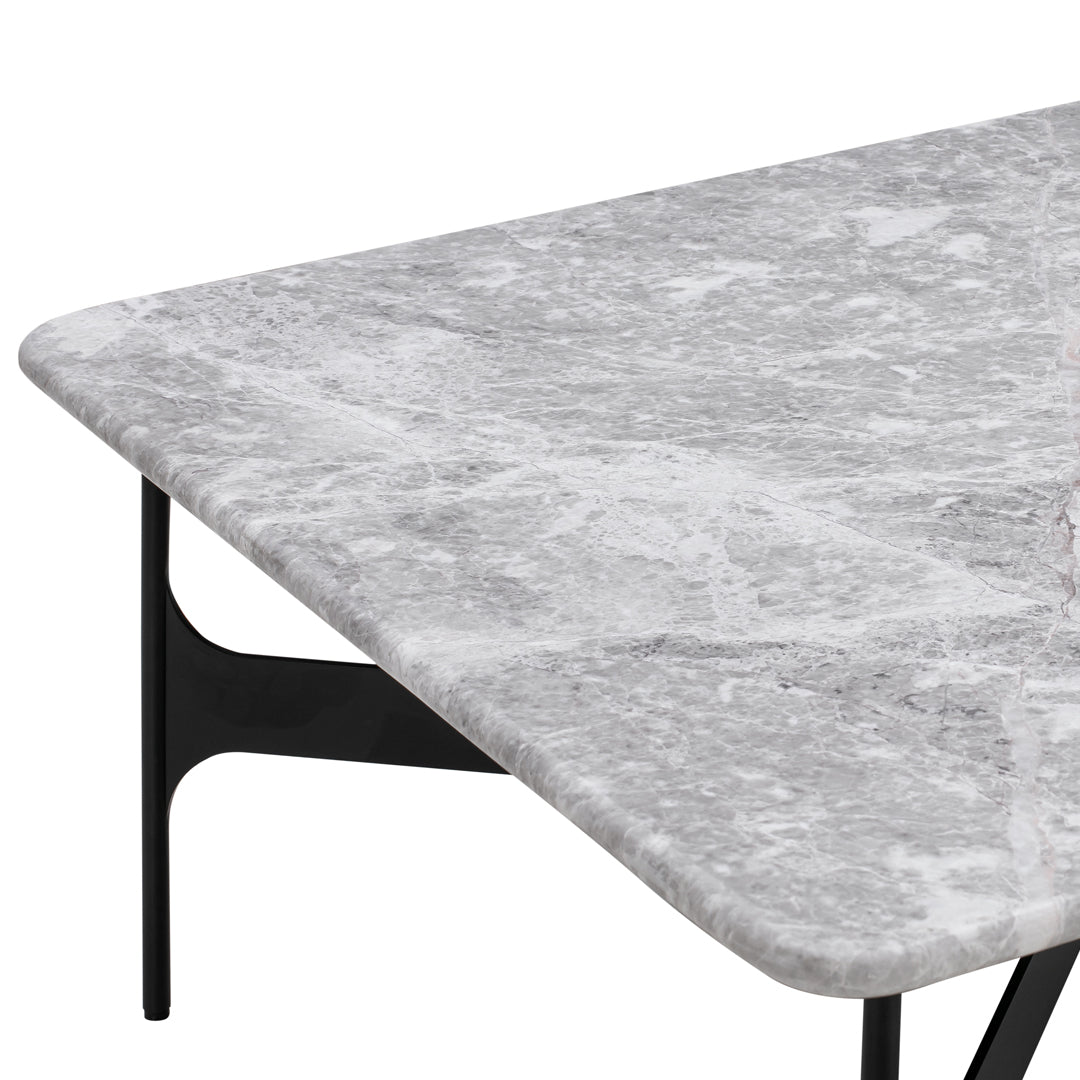 Gray marble tabletop with subtle veining patterns, complemented by sleek black metal legs. Perfect for modern decor.