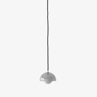 Gray pendant light with a minimalist design and black cord, featuring a sleek, curved shade.