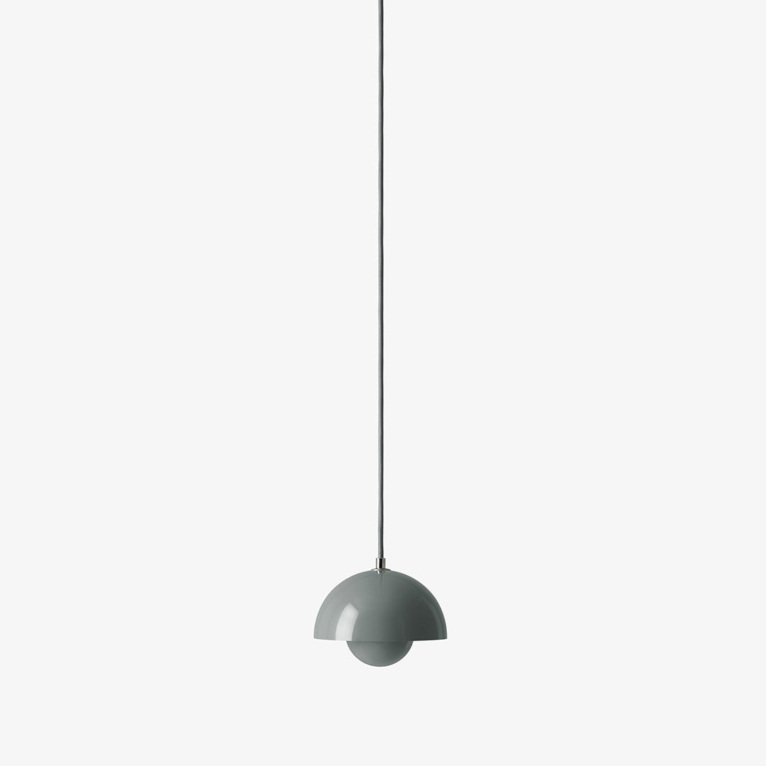 Gray pendant light with a sleek, modern design and smooth surface, featuring a half-dome shape.