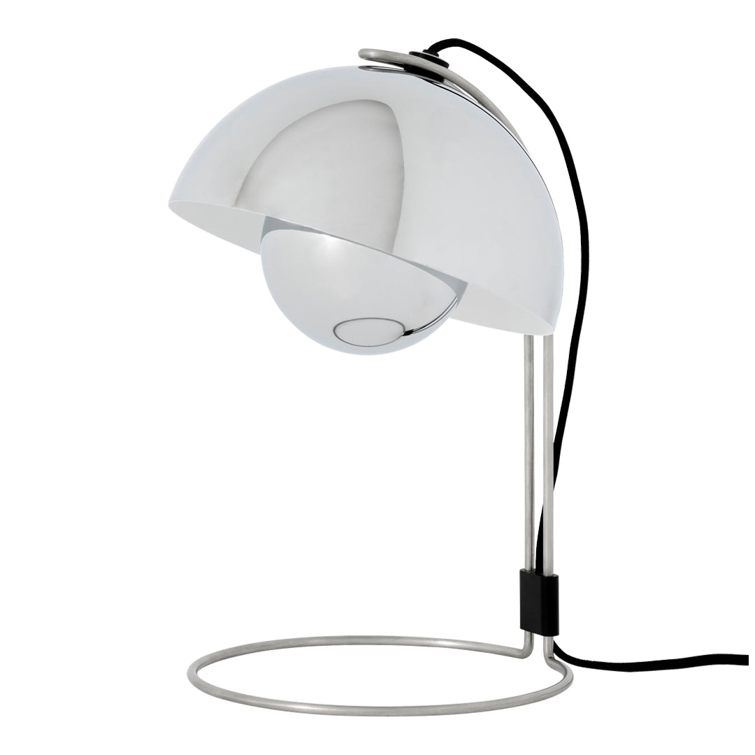 Modern white lamp with a glossy finish, sleek circular base, and a contrasting black power cord.