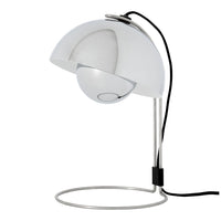 Modern white lamp with a glossy finish, sleek circular base, and a contrasting black power cord.