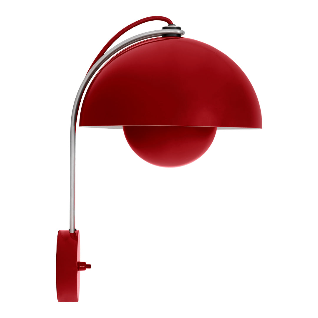 Red dome-shaped lamp with a glossy finish and chrome accents, featuring a sleek, modern design.