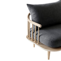 Modern gray fabric sofa with a light wooden frame, featuring clean lines and a minimalist design. Perfect for stylish interiors.