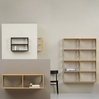 Modern wooden shelves in natural oak and minimalist black against soft beige walls, showcasing geometric patterns.