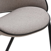 Light gray textured fabric chair cushion with a sleek black trim, showcasing modern design and minimalistic aesthetics.