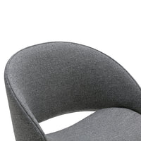 Gray upholstered chair with a smooth, curved design and subtle textured pattern. Perfect for modern interiors.