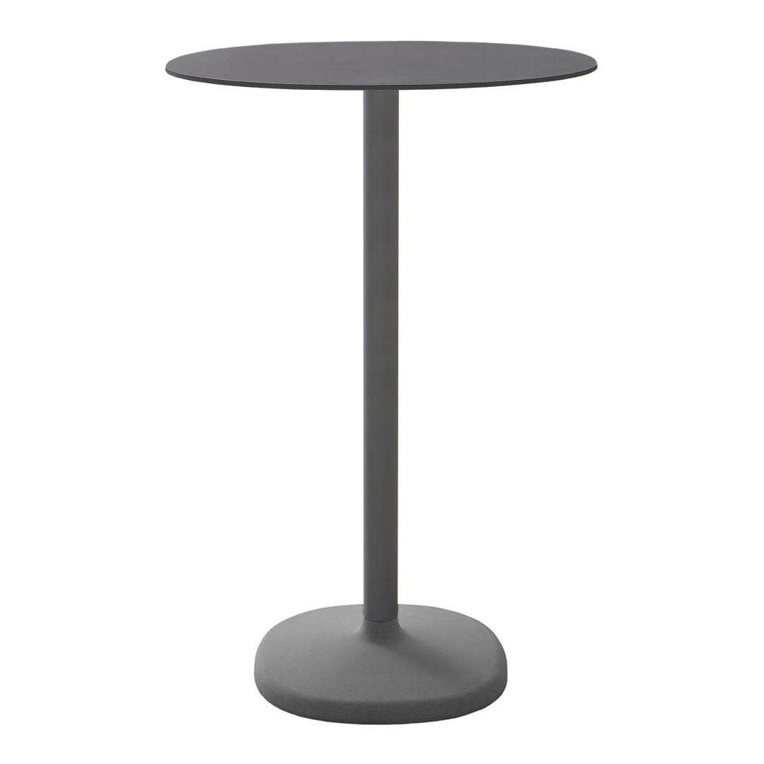 Round, dark gray side table with a smooth finish and minimalist design, perfect for modern decor. 