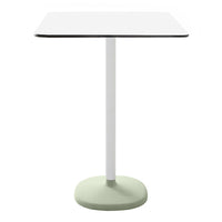 Modern square table with a white top, sleek black edge, and a soft green base. Simple, minimalist design.