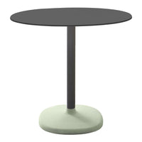 Round black tabletop with a sleek gray pole and a soft green base, featuring a minimalist design.