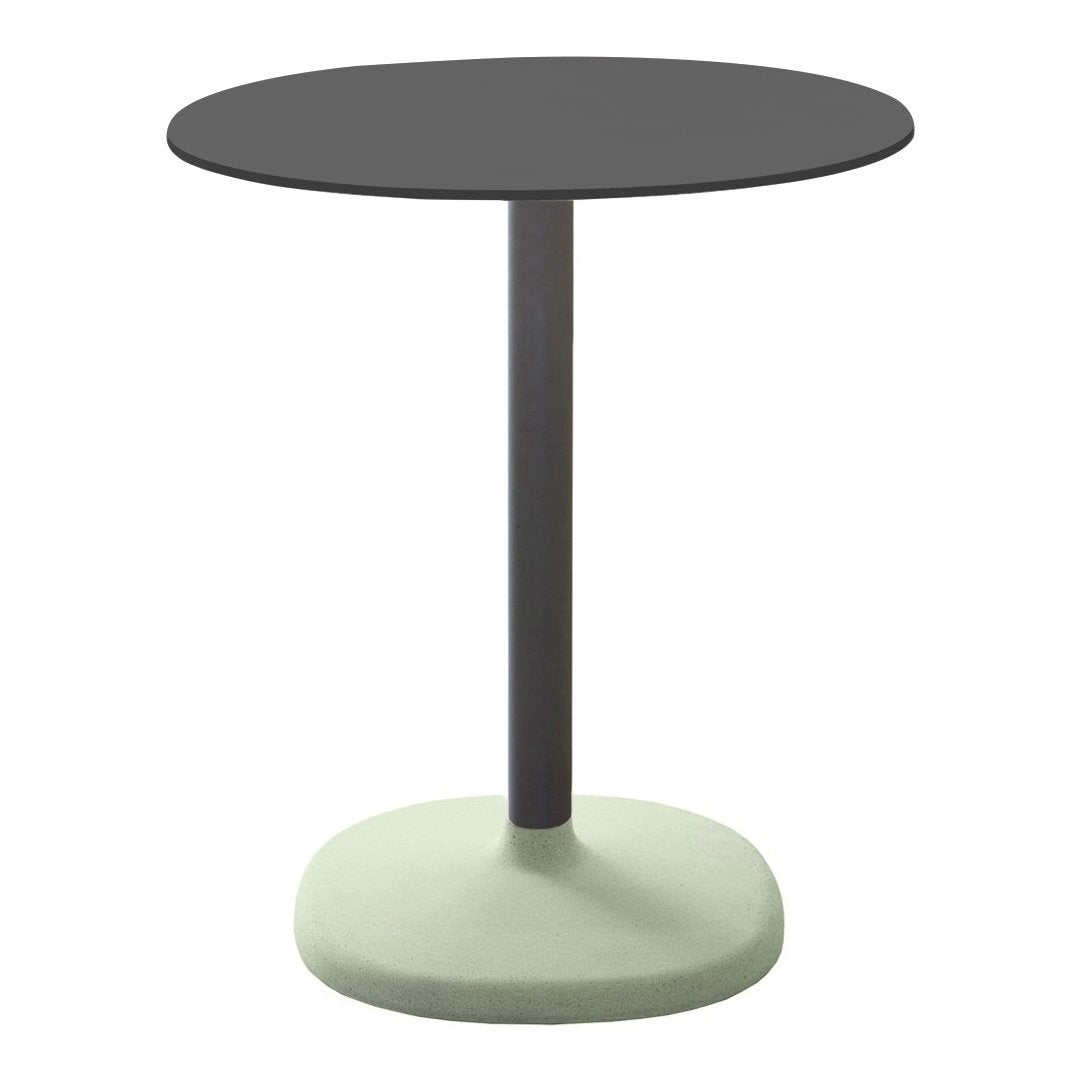 Black round tabletop with a sleek gray stem and a light green circular base. Modern and minimalist design.