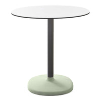 Round table with a white top, sleek black base, and a soft green pedestal. Modern and minimalist design.