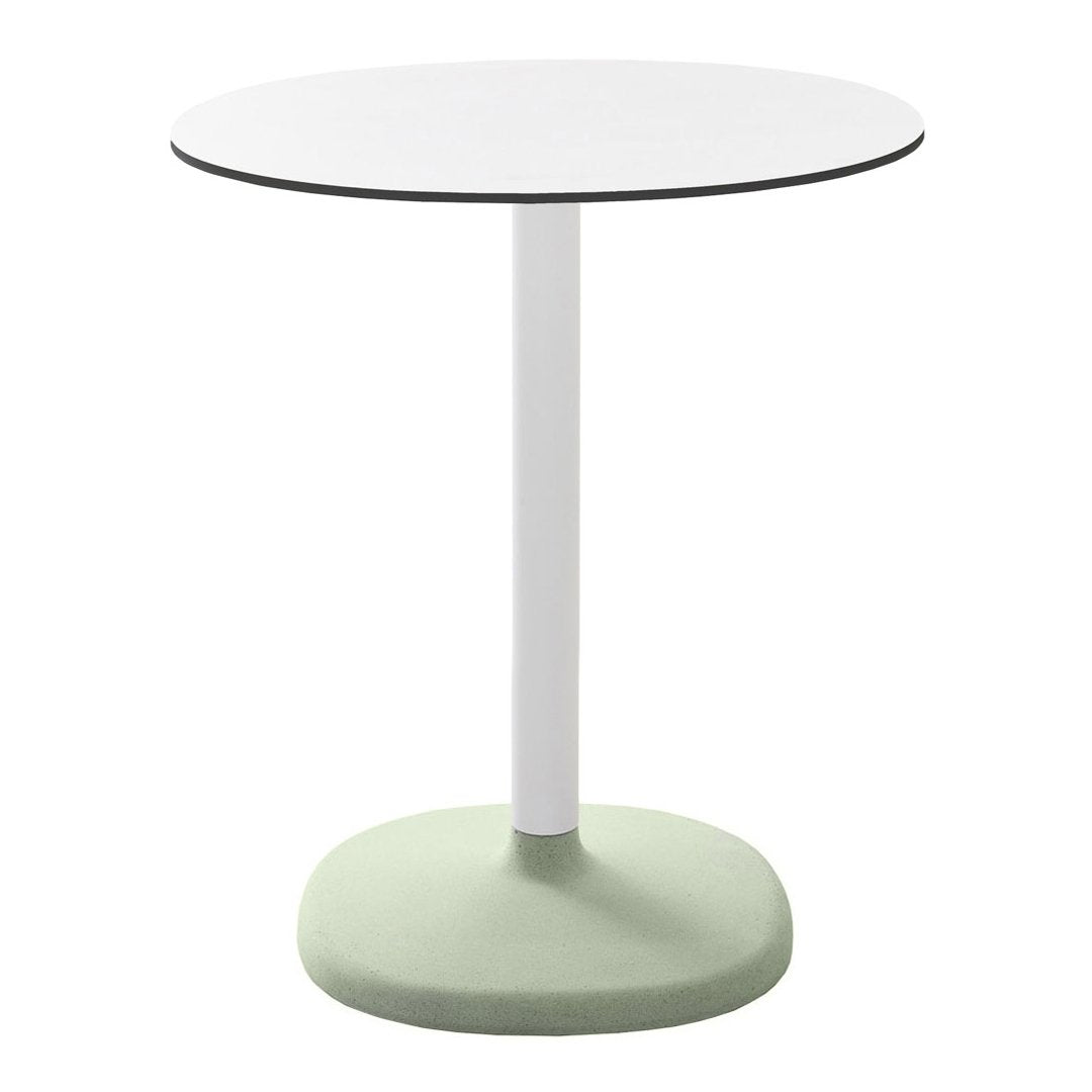 Round table with a white top, slim white pole, and a soft green base, featuring a minimalist design.