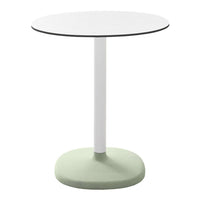Round table with a white top, slim white pole, and a soft green base, featuring a minimalist design.