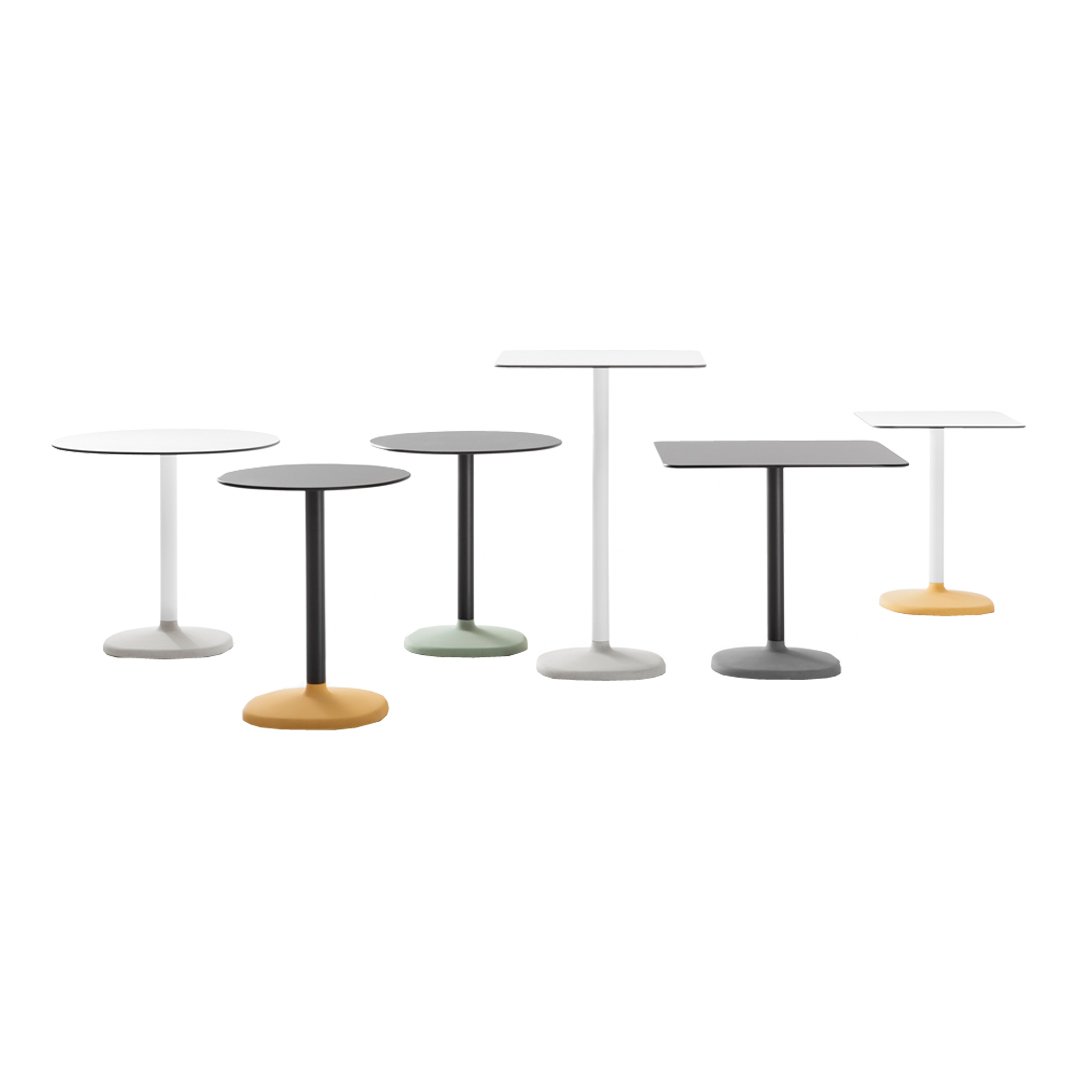 Set of modern tables in white, black, grey, green, and orange with sleek, minimalist designs and round shapes.