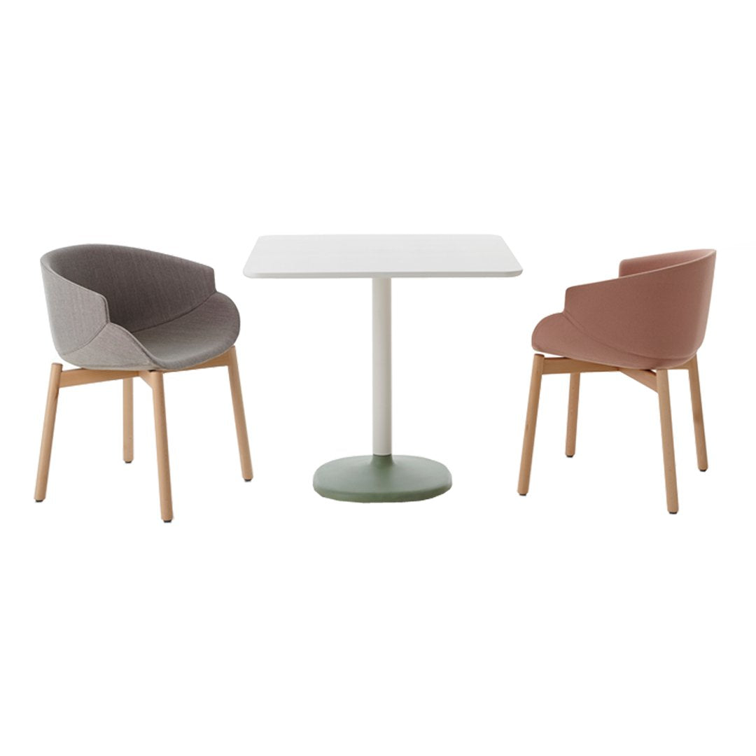 Modern dining set featuring gray and terracotta chairs with wooden legs, accompanied by a white tabletop and green base.