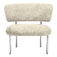 Cream-colored chair with soft, plush texture and sleek chrome legs, showcasing a minimalist design.