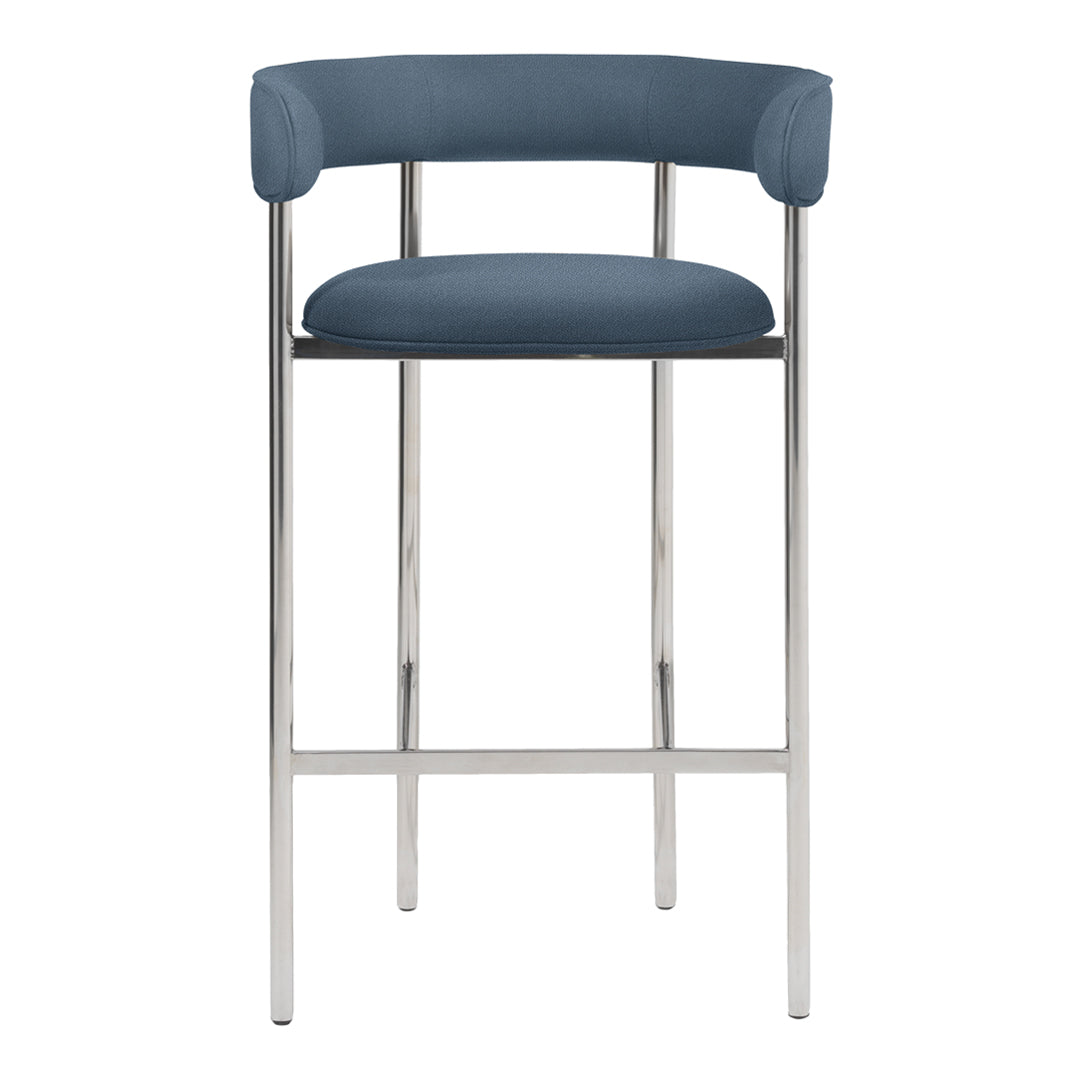 Blue upholstered bar stool with a sleek chrome frame and minimalist design. Modern, stylish accent for any space.
