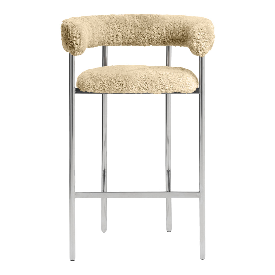 Beige faux shearling upholstery on a sleek chrome frame, featuring a modern and minimalist design.